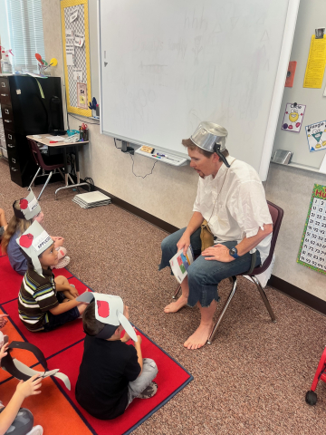 Johnny Appleseed reading a story