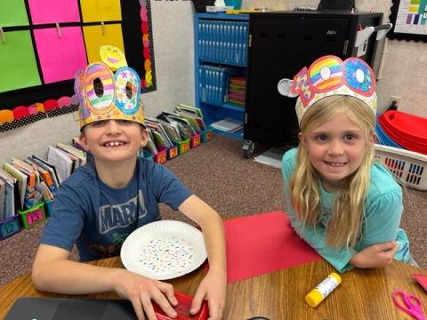 Showing off their hundreds hats